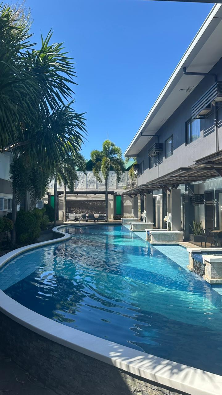 Circle Inn Hotel & Suites Bacolod — outdoor pool and hotel amenities